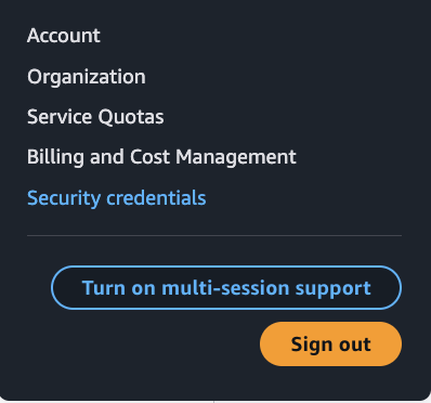 A screenshot of the AWS console with the user menu open and an arrow pointing to "Security credentials".